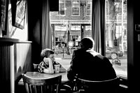 boy-listening-to-the-man-reflected-in-the-window