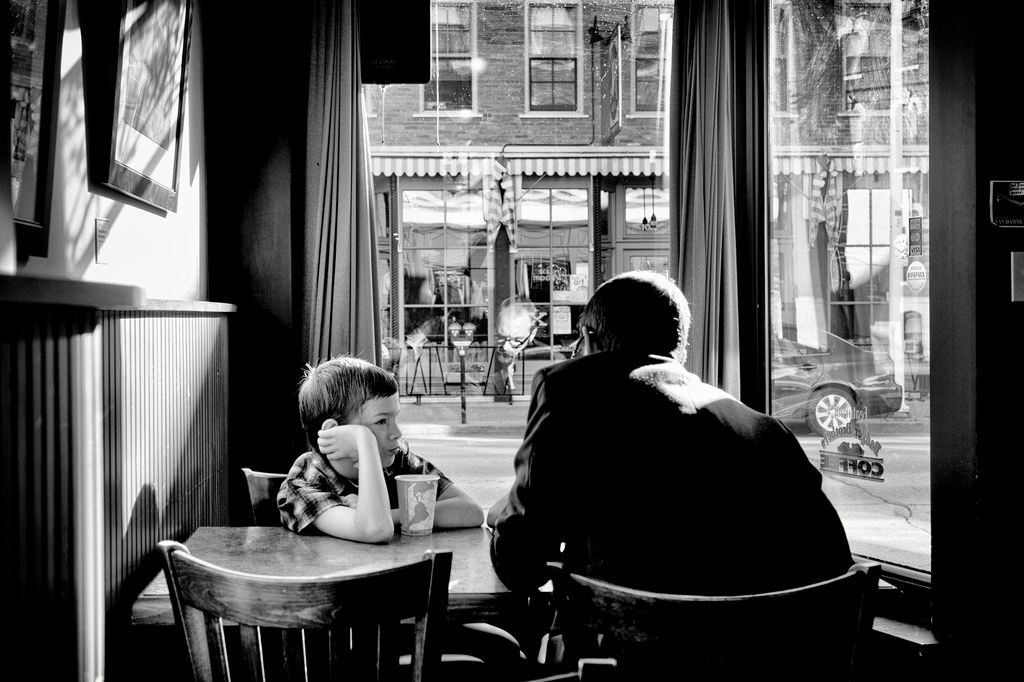 boy-listening-to-the-man-reflected-in-the-window